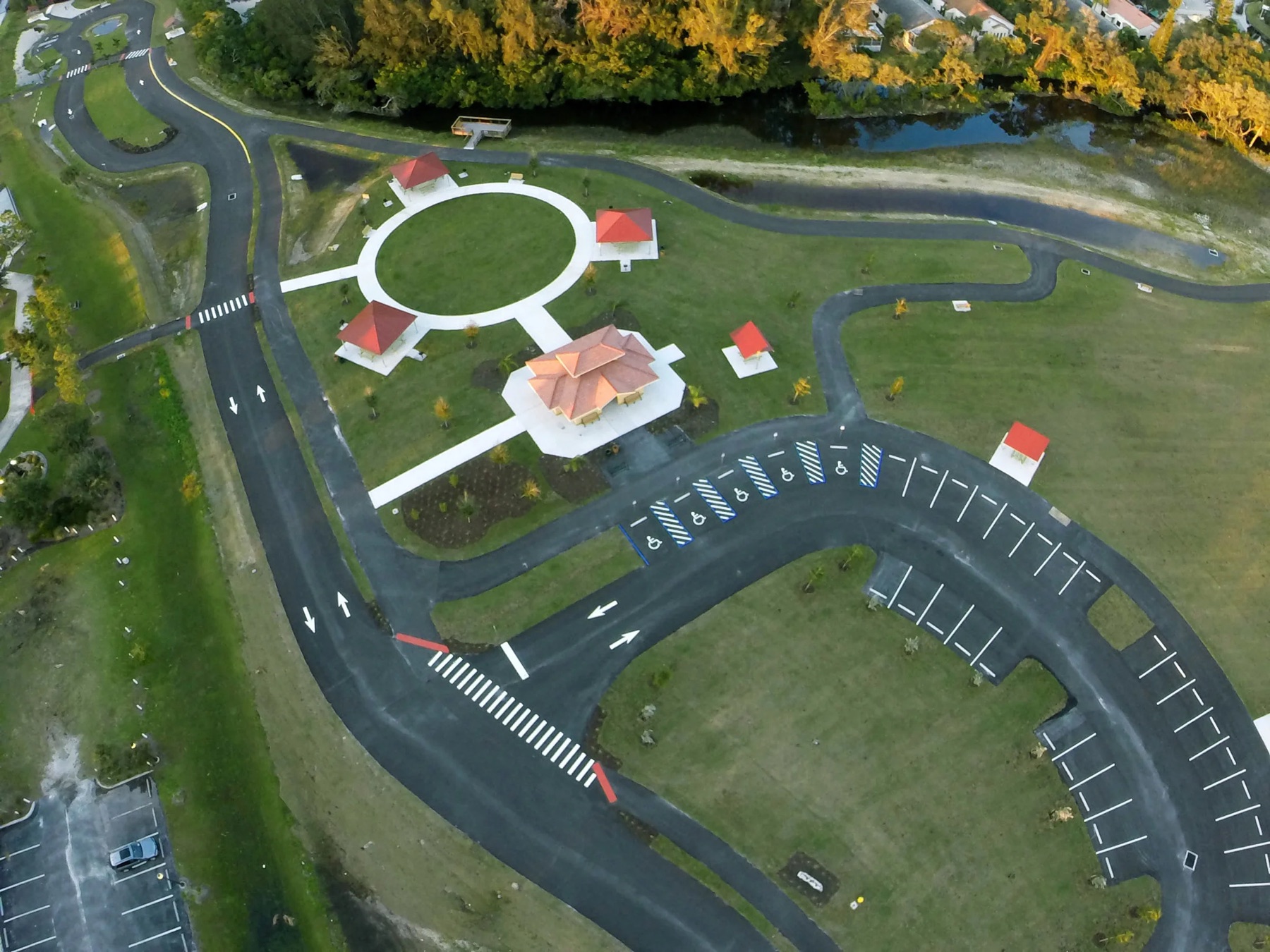 Aerial view of Legacy Park lawns, pavilions, paths, and parking in Venice, Florida